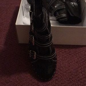 Shultz bootie boots with a classy buckle look.